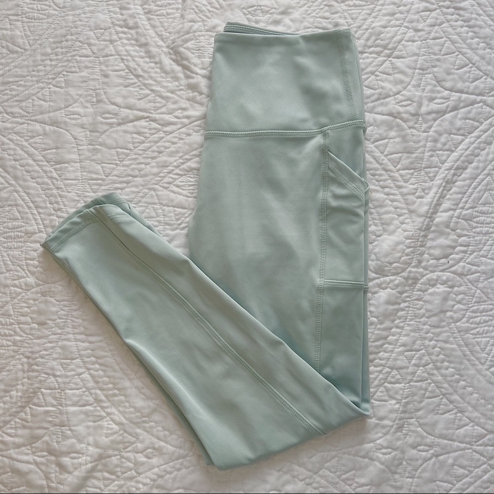 Pastel mint high waisted leggings with pockets and criss cross detail